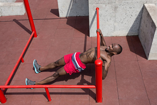 Athlete doing exercises at stadium