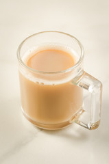 cup of tea with milk/cup of tea with milk on a white background, selective focus