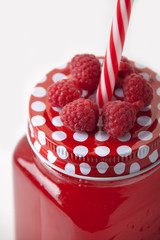   Raspberry drink in a glass mug for drinks