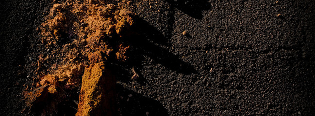 surface of the asphalt and the remains of the destroyed brick are illuminated by sunlight. Web...