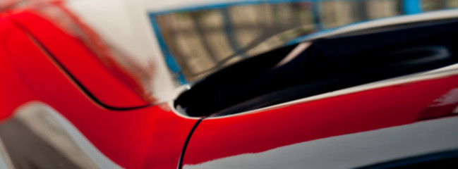 reflection on the paint surface of the car body. Web banner.