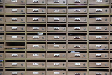 Obraz premium Mailboxes in the condo. wooden mailbox pattern with lockable center in condo.