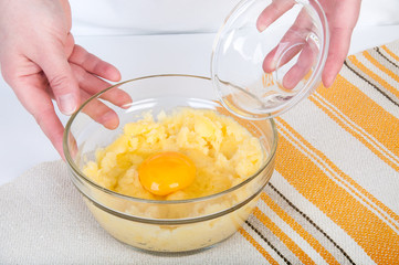 Glass bowls with boiled potatoes and egg.