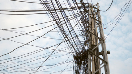 Electric pole with wires. High voltage power pole with wires tangled.