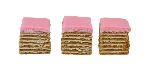 Small piece of meny layers cake with cream and strawberry frosting. Pink  decoration on the top. White background