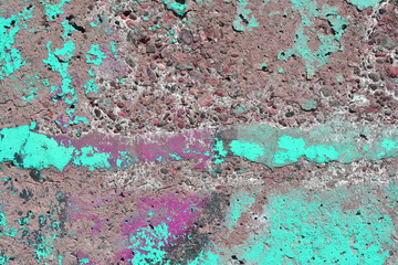 The rough uneven concrete surface is partially painted turquoise. original design background.