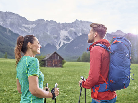 Austria, Tyrol, Mieming, couple hiking in alpine scenery