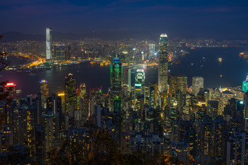 Hong Kong and Victoria Harbour cityscape at night viewed from Lugard Road near Victoria Peak