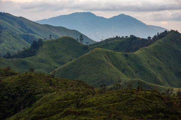 Fototapeta premium Beautiful sunset over the mountain range at the west of (Khao Chang Puak) at kanchanaburi Thailand