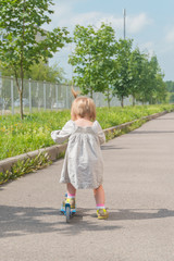 summer day girl, child on scooter