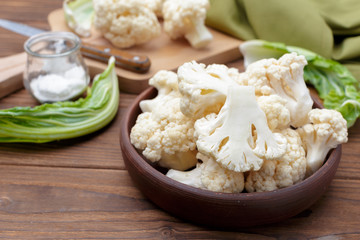 Organic cauliflower on wooden background