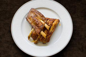 Detail of roasted ribs on the plate