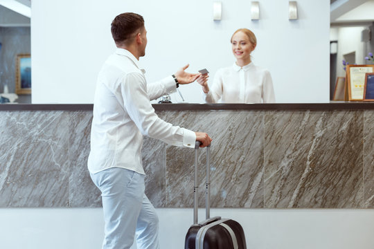 Man At Hotel Reception.