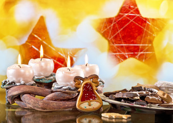 Advent Wreath with Burning Candles on the Red Background