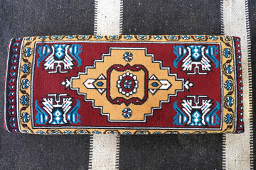 Traditional Turkish handmade wicker pillow on a goat hair kilim.