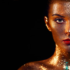 Portrait of Beautiful Woman with Sparkles on her Face. Girl with Art Make-Up in Color Light....