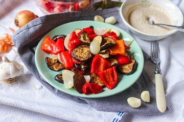 Tasty roasted grilled vegetables (Ratatouille) with eggplant, red pepper, onion, grilled. Vegan lunch, vegetarian healthy dinner. Vegetarian food concept