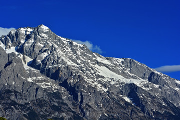 summit of high mountain covered by snow in Lijiang, China