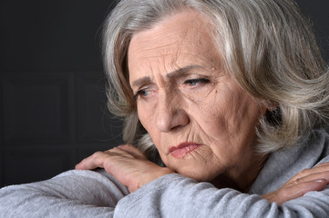 Close up portrait of tired senior woman