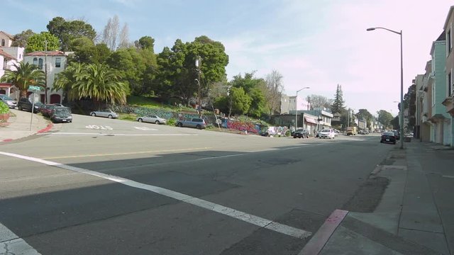 A Wide Shot Of A Street In Oakland, California Filled With Graffiti That Will Later Be Transformed By Volunteers In A Community Mural Art Project.