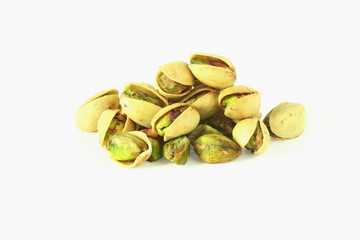 Roasted pistachio nut seed with shell closeup isolated on white background