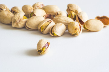 Obraz na płótnie Canvas Close Up Group Of Dry, Fresh And Large Raw Pistachio Nuts In Shell
