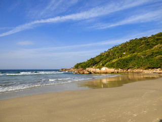 A view of Brava beach, located in Florianopolis, Brazil - Morro das Feiticeiras in the background