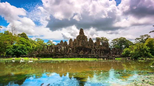 4K Time lapse of a Bayon temple at Angkor Thom reflected in water, Siem Reap province of Cambodia