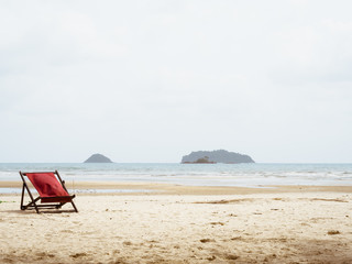 Red beach beds on summer beach.