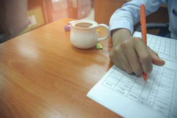 Female employees are checking account.