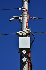 Obraz premium speed control radar camera on a metal support. complex system. side view
