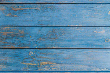 Blue wooden wall. Old shabby wooden planks with cracked color paint. Background. Texture wood.