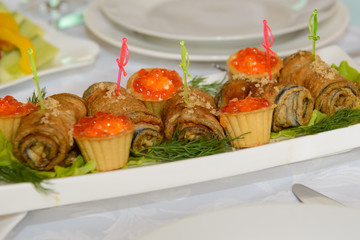 Tartlets with filling the table with food.  Luxury feast at the Banquet. 