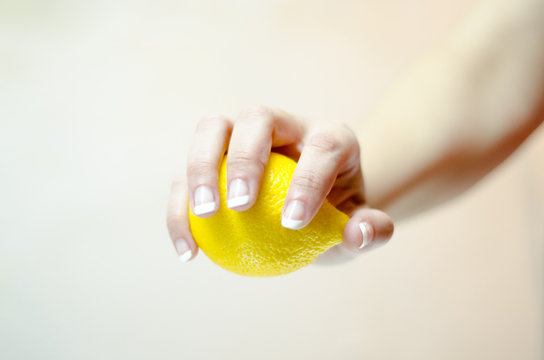 woman hand keep fresh lemon