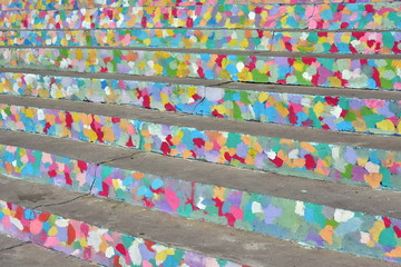 abstract spot of colored paint on staircase concrete steps
