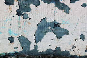 Closed up of flaking color wood plank's texture background. 