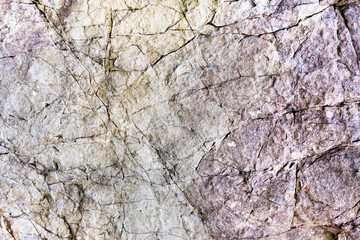 Rock texture and surface background. Cracked and weathered natural stone background.