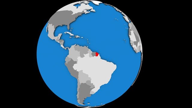 Zooming on French Guiana on slowly rotating political globe. 3D animation.