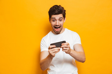 Portrait of an excited young man playing games