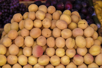 Juicy fresh apricots on window counter, on natural light.