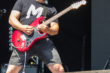 Obraz premium Guitarist play electricity guitar on concert stage