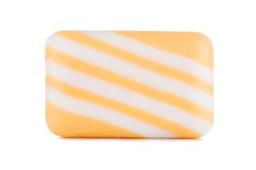Group of yellow multi colored striped soaps isolated on white background