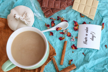 Chocolate, rose,coffee and cinnamon. Layout on a blue background. Plate 