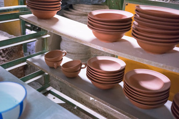 Ceramic dishes in working process. Creating ceramic pieces. Tradicional ceramic factory in spain