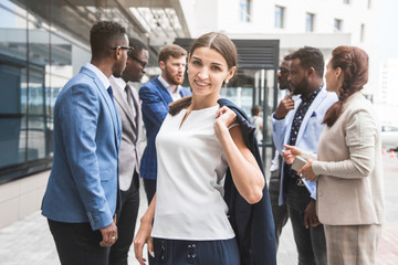 Portrait of an handsome businesswoman in front of his team. recognition, movement on the career ladder, success in business
