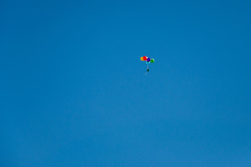 Naklejka na ściany i meble Background colorful balloons flying in the blue sky