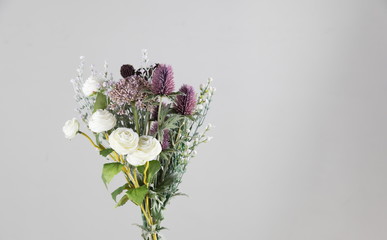 wild and beautiful flower bouquet on light background.