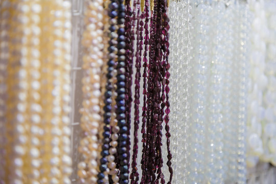 beautiful multicolor beads in necklace form, marvelous colorful beads in necklace form as background, texture.