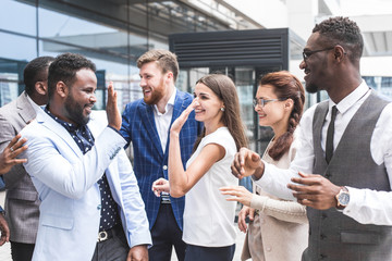 Portrait of an handsome businessman in front of his team. recognition, movement on the career ladder, success in business