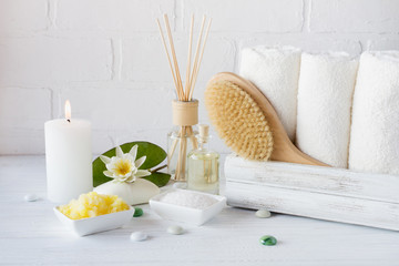 Fototapeta na wymiar Spa treatment - towels aromatic soap, bath salt, and oil, and accessories for massage and bathroom.